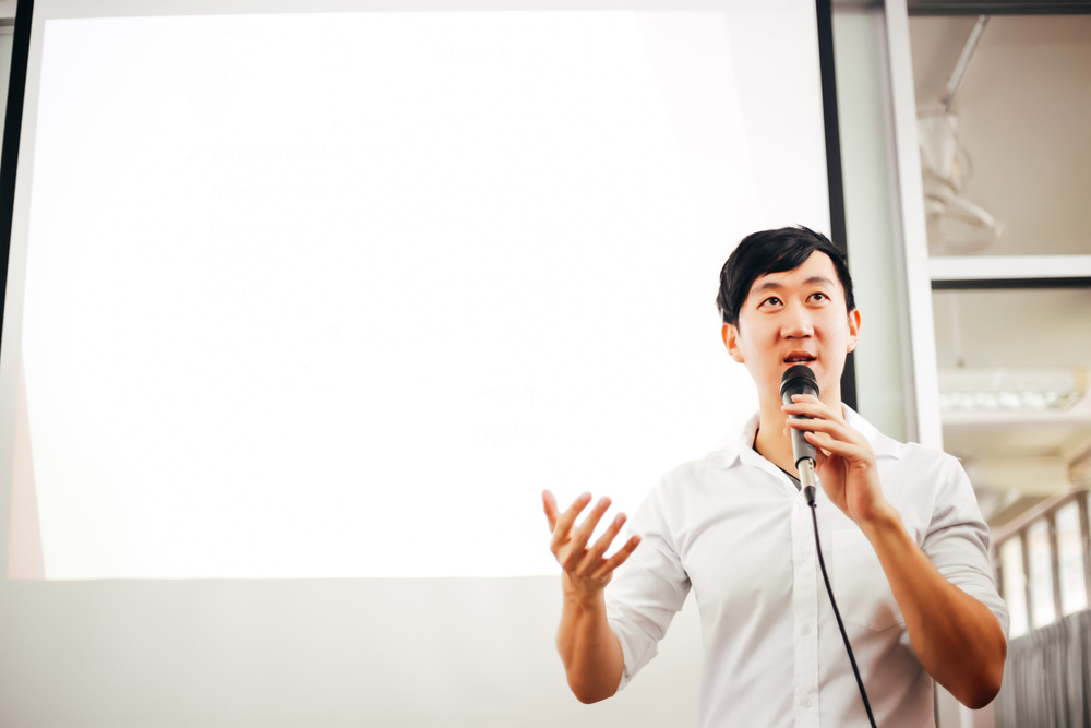 Portrait of Young Handsome Asian Male Speaker Publicly Speaking